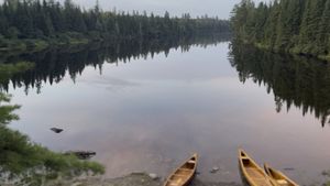 Canoes on a still lake